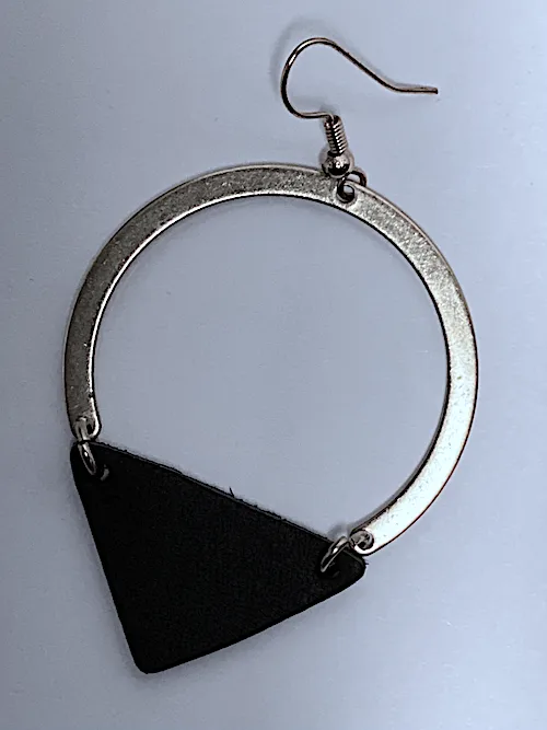 one earring with a triangle hanging from the bottom of it.