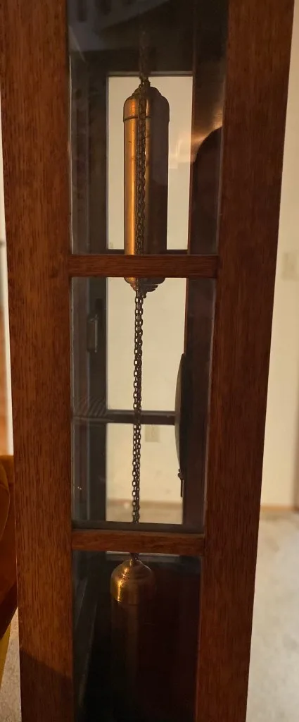 Weights hanging in a Grandfather clock