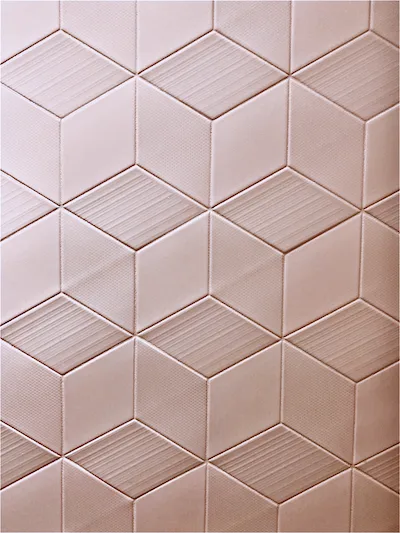 rose-pink hexagonal wall tiles