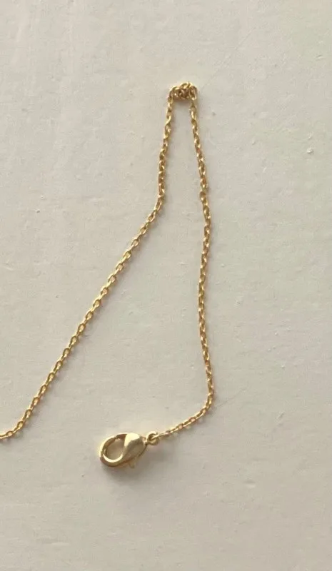 A necklace chain with a knot in it.