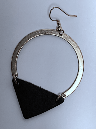 one earring with a triangle hanging from the bottom of it.